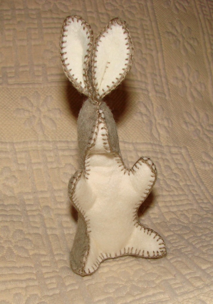 Wool felt bunny rabbit standing up on hind legs